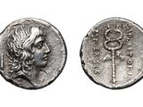 a silver coin with an image of a woman on it