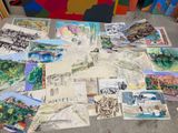 a lot of paintings that are on the floor