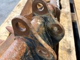 a close up of a rusted pipe on a pallet