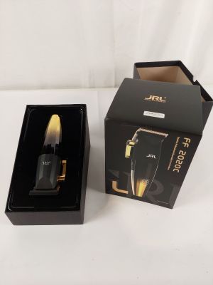 a box with a brush inside of it on a white surface