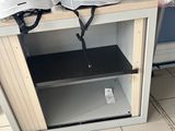 helmets on top of a cabinet in a room