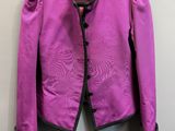 purple jacket hanging on a hanger on a wall