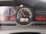 a close up of a car dashboard with a speedometer