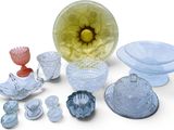 a lot of glass items that are sitting on a table