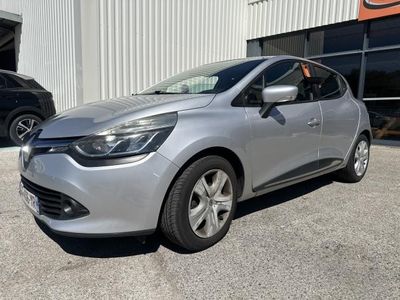 a silver car parked in front of a building