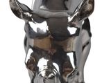 a silver statue of a cow wearing a hat