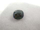 a black diamond on a white surface