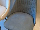 two chairs that are next to each other on the floor