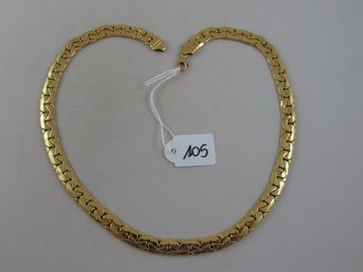 a close up of a gold necklace with a price tag on it