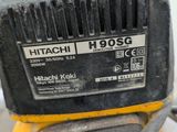 a close up of a yellow and black machine on a table