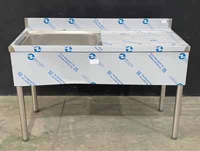 a stainless steel sink with two sinks under it
