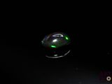 an image of a soap bubble floating on a black surface