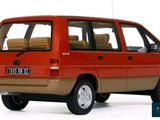 a small red car that is parked on a white surface