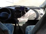 a view of the inside of a car from the driver ' s seat