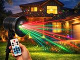 a person holding a remote control in front of a house