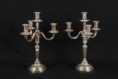 a pair of silver plated candelabs with four arms