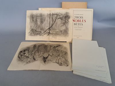 trois livres posés sur une table, avec un dessin représentant un ours et un ours