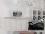 many different types of screws and nuts in this box