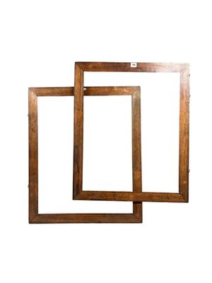 two wooden picture frames on a white background with a white background
