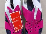 a close up of a pair of shoes with a tag on them