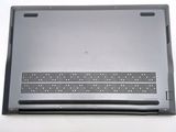 the back of a laptop with a metal cover on a white surface