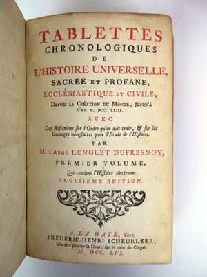 an open book with a title on it sitting on top of a table