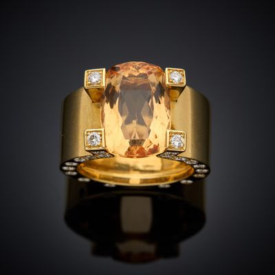 an image of a yellow gold ring with a large citrine stone and diamonds