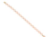 a pink beaded bracelet with gold beads