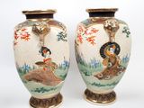 pair of asian vases with asian scenes on them on a white background