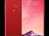 the red vivo phone is shown with a mountain in the background