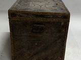 a small wooden box sitting on a white surface