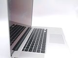 a close up of a laptop computer on a white surface