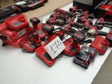 a lot of power tools on a table with a price tag