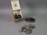 a small display of coins and a book on a table