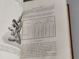 an open book with a picture of a microscope on it