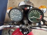 two gauges on the handlebars of a motorcycle