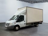 a white truck that is parked in a large room