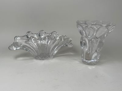 pair of clear glass vases sitting on top of a white table