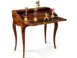a small wooden desk with a glass top on it