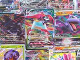 many different types of pokemon cards on the table