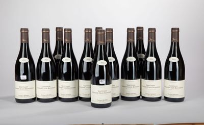 six bottles of wine are lined up in a row on a table