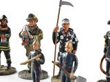 many figurines of different types of firemen on display