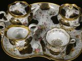 a tray with a tea set on it on a table