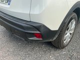 a white car parked on the side of the road