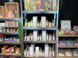 many different types of soaps on the shelves in the store