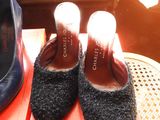 two pairs of shoes that are sitting on a table
