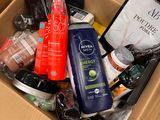 a cardboard box filled with different types of skin care products
