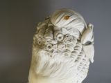 a statue of a woman with a flower in her hair
