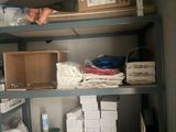 many boxes and boxes on the shelves in the closet