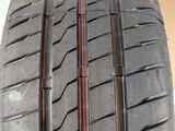 a close up of a tire with a red stripe on it